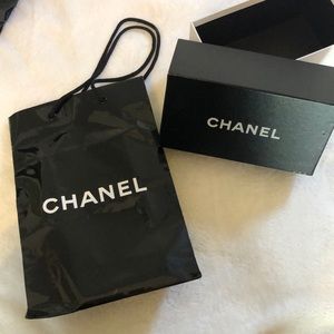 Empty Chanel shopping bag and sunglasses box